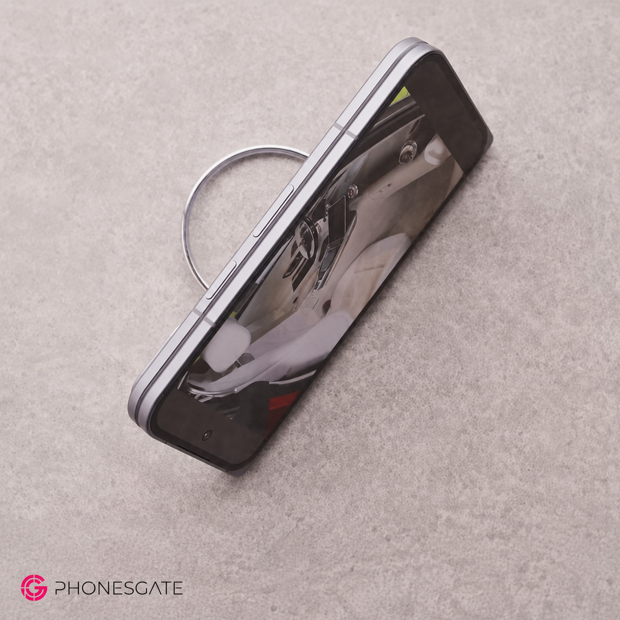 Foldable Pixel phone attached to a magnetic charging ring accessory