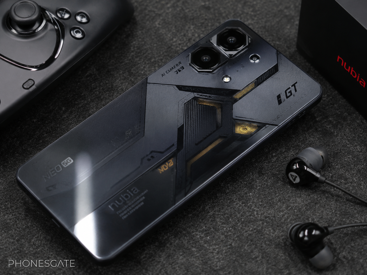 Nubia Neo 5 GT with gaming accessories on a desk and subtle PhonesGate logo