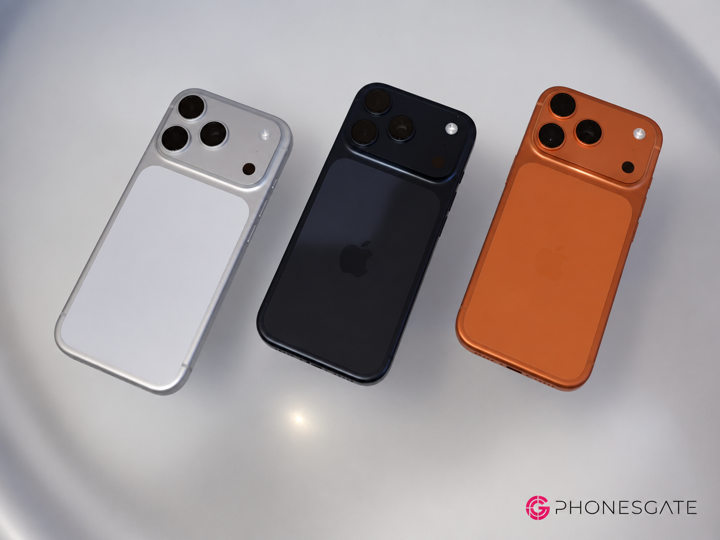Three iPhone Pro concepts shown in silver dark gray and orange finishes