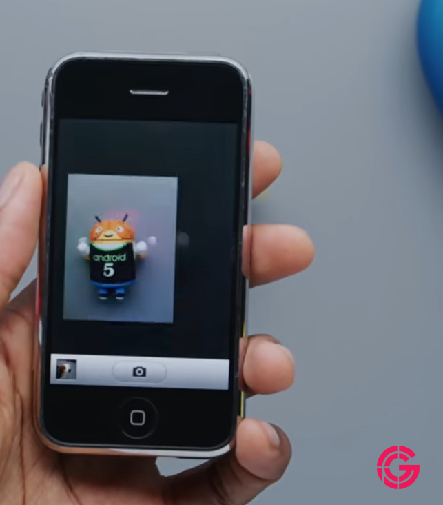 Original iPhone camera viewfinder photographing a small figurine