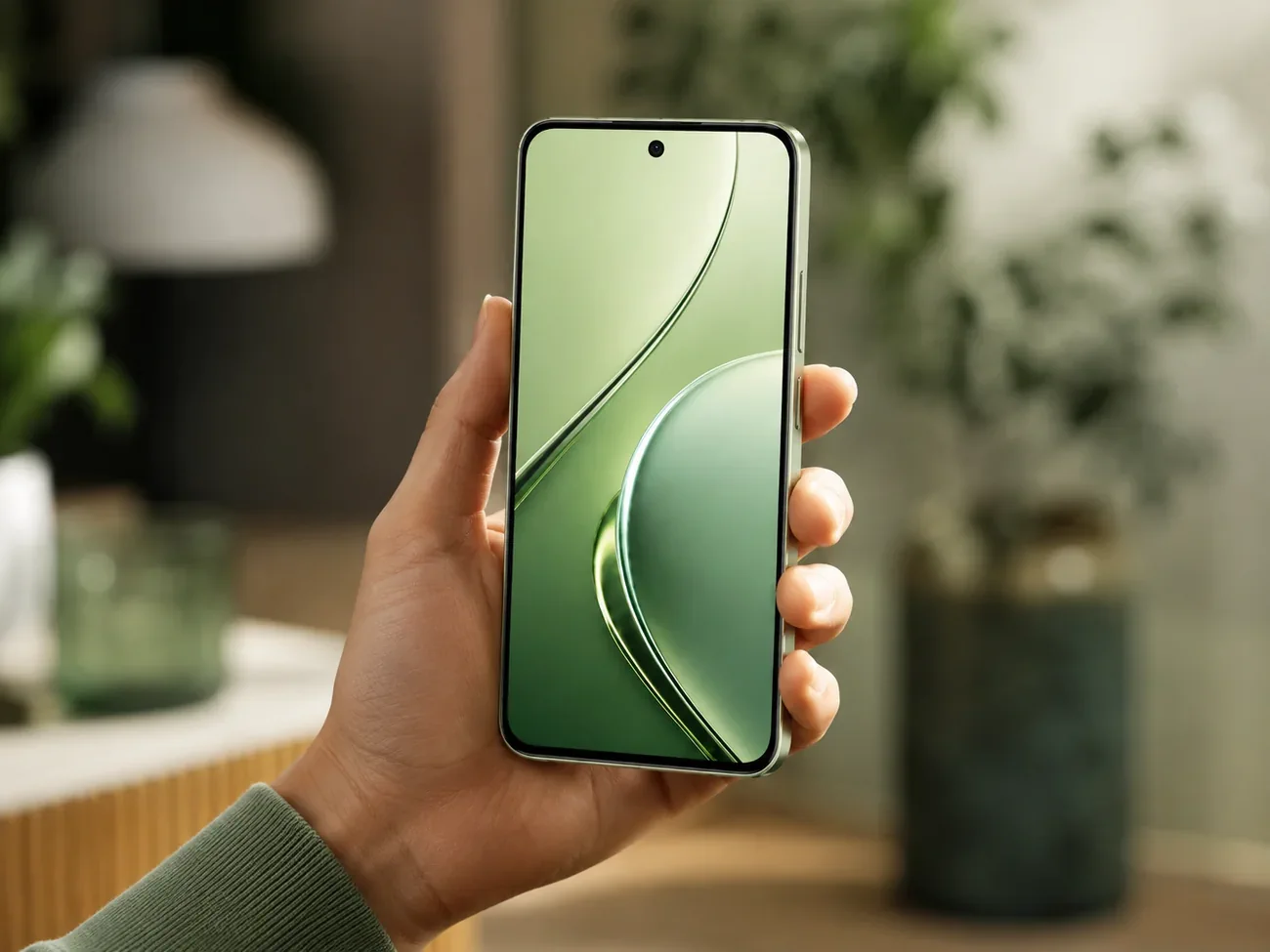 realme P4s 5G being held in hand showing the display
